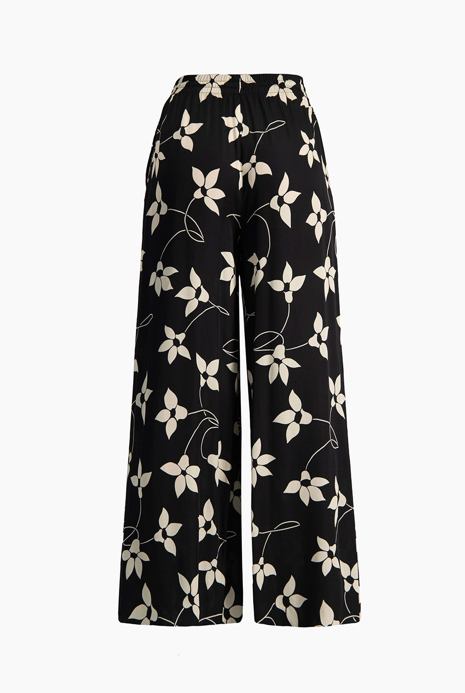 Pantalón amplio negro con estampado floral y bolsillos